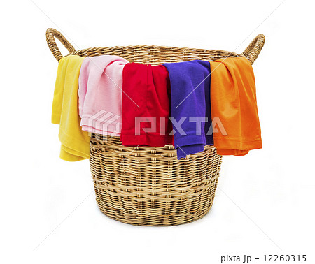 Colorful clothes in a laundry wooden basket on white background Colorful clothes in a laundry wooden basket on white background 12260315