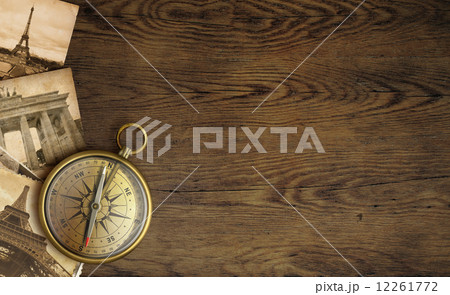 Adventure concept, old pictures and compass on wooden table Adventure concept, old pictures and compass on wooden table 12261772