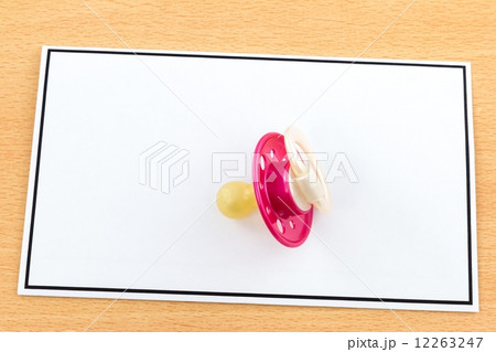 Death of a Child, Red Pacifier on Card Death of a Child, Red Pacifier on Card 12263247