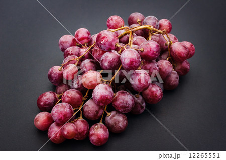Red ripe grape over grey Red ripe grape over grey 12265551