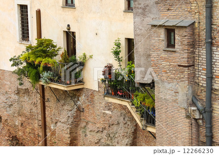Picturesque Italian house with flowers on the balconies 12266230