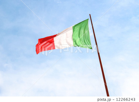 Flag of Italy against the blue sky 12266243