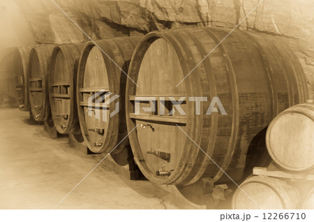 Aged photo of barrels in french winery Aged photo of barrels in french winery 12266710