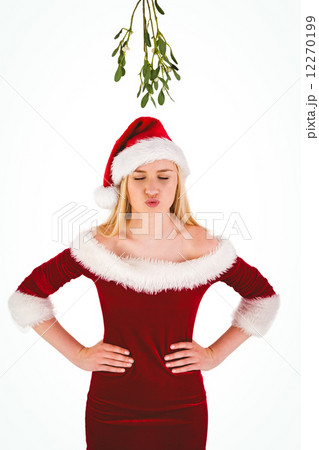 Festive cute blonde under mistletoe Festive cute blonde under mistletoe 12270199