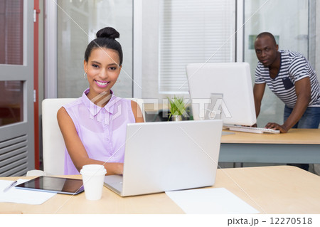 Portrait of businesswoman using laptop Portrait of businesswoman using laptop 12270518