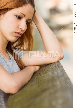Sad redhead thinking about her life 12270891
