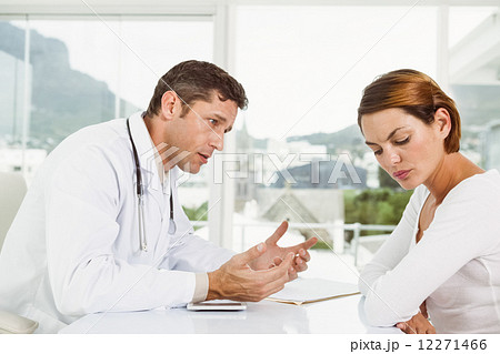 Doctor in discussion with patient in medical office Doctor in discussion with patient in medical office 12271466
