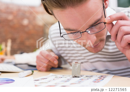Concentrated male photo editor at work Concentrated male photo editor at work 12271565