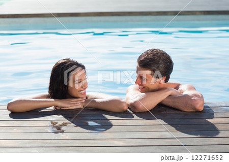 Couple in swimming pool on a sunny day Couple in swimming pool on a sunny day 12271652