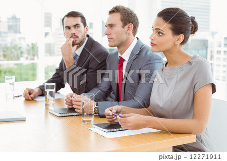 Panel of corporate personnel officers sitting in office Panel of corporate personnel officers sitting in office 12271911