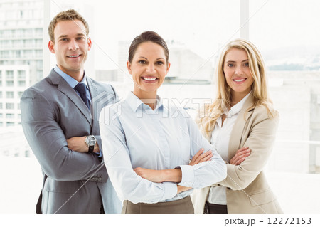Young business people with arms crossed in office 12272153