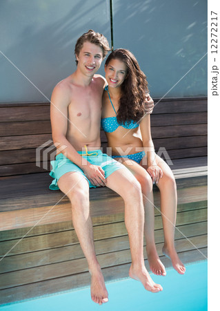 Romantic young couple by swimming pool Romantic young couple by swimming pool 12272217