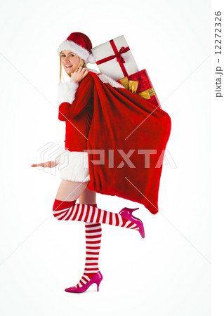 Festive blonde carrying sack of presents 12272326