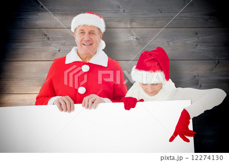 Composite image of festive couple showing poster 12274130