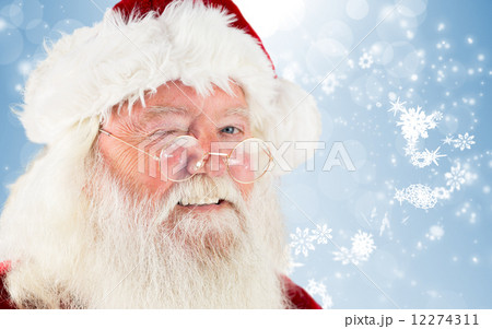 Composite image of santa claus winking 12274311
