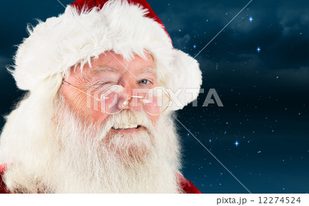 Composite image of santa claus winking 12274524