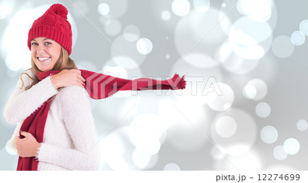 Composite image of happy blonde in winter clothes Composite image of happy blonde in winter clothes 12274699