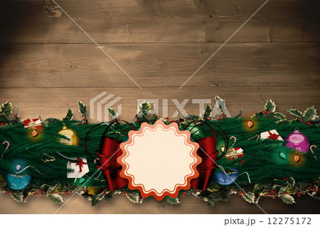 Composite image of fir branch christmas decoration garland Composite image of fir branch christmas decoration garland 12275172