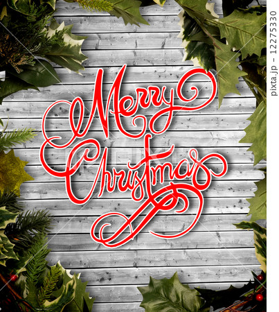 Composite image of holly and christmas branches forming frame 12275330