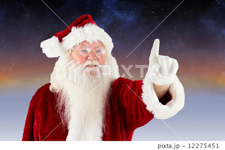 Composite image of santa claus pointing 12275451