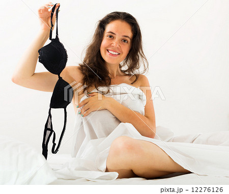 Girl takes off underwear on bed Stock Photo 12276126 PIXTA