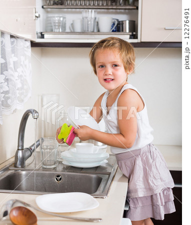 Baby girl washing dishes 12276491