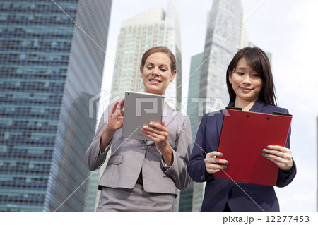 Businesswomen working outside Businesswomen working outside 12277453
