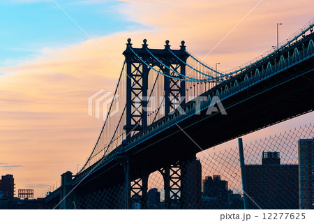 Manhattan Bridge and skyline silhouette view from Brooklyn at sunset 12277625