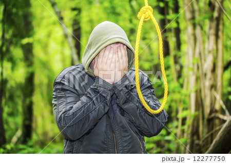 Man near noose in the woods Man near noose in the woods 12277750