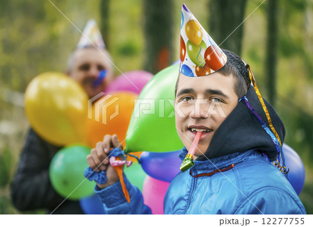 Boy with balloons in birthday party at outdoors Boy with balloons in birthday party at outdoors 12277755