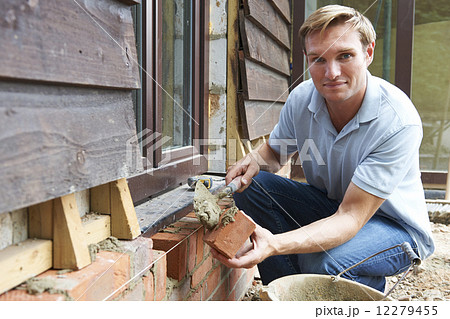 Portrait Of Construction Worker Laying Bricks 12279455