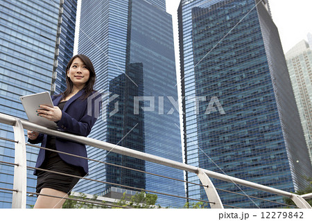 Businesswoman using tablet outdoors 12279842