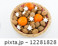 Basket with Walnuts, Tangerines and Cinnamon Stars 12281828