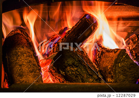 Old fireplace with a burning firewoods 12287029