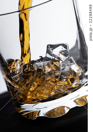 glass of whiskey and ice 12288499