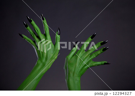 Green monster hands with black nails, real body-art 12294327