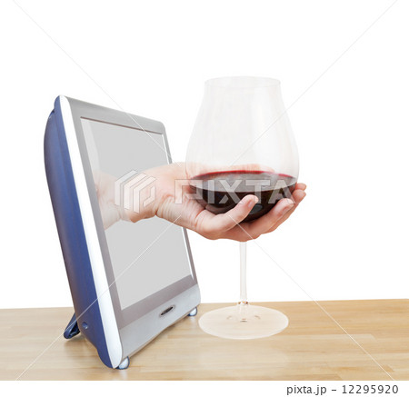 hand holding big glass with red wine leans out TV hand holding big glass with red wine leans out TV 12295920