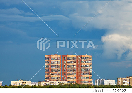 dark blue rainy sky over multistory houses 12296024