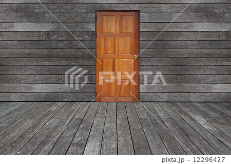 Wall with door and floor siding weathered wood background 12296427
