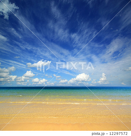 landscape with gold sand beach and clouds 12297572
