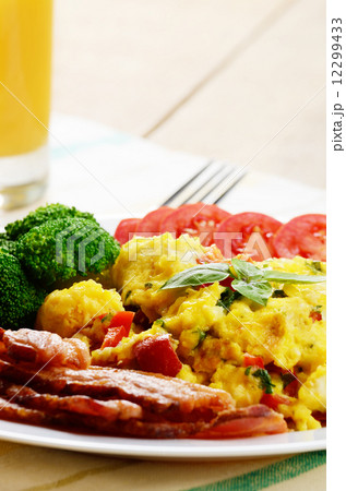 Scrambled eggs with bacon 12299433