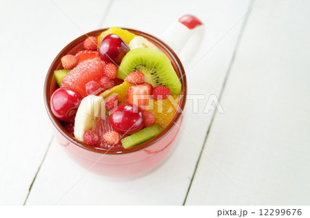 Red cup with fruits Red cup with fruits 12299676