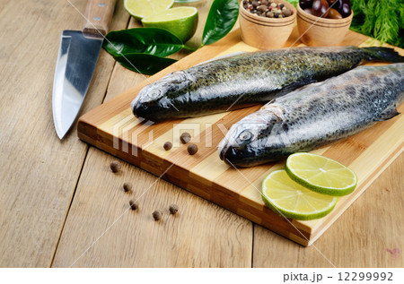 Raw trout on the cutting board Raw trout on the cutting board 12299992