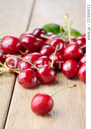 Organic Cherries on the wooden table Organic Cherries on the wooden table 12300911