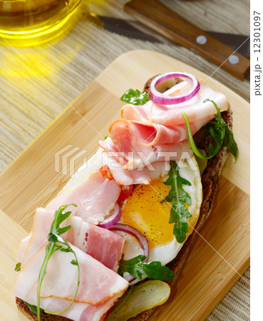 Bacon and fried eggs open sandwich 12301097