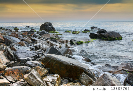 seascape, scenic large stones against the sea and sky 12307762