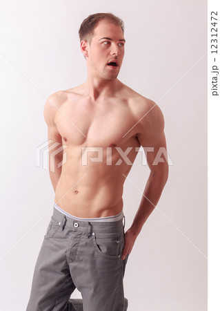 Handsome athletic man with a strong physique 12312472