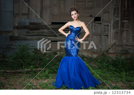 Beautiful lady in luxury blue dress with pearl Beautiful lady in luxury blue dress with pearl 12313734