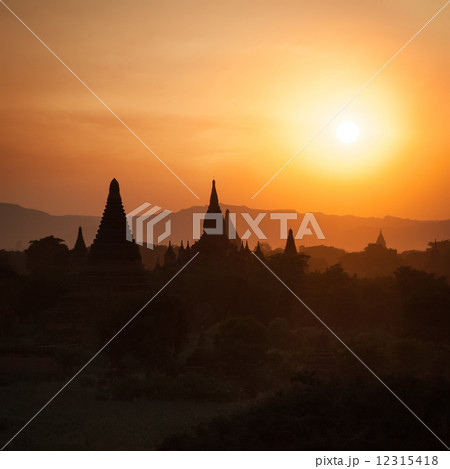 Sunset silhouettes of Buddhist Temples at Bagan Kingdom, Myanmar 12315418