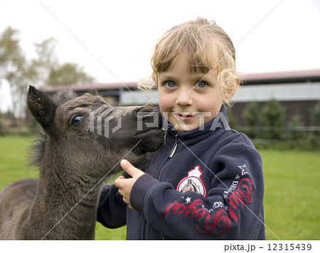 Girl and the foal Girl and the foal 12315439